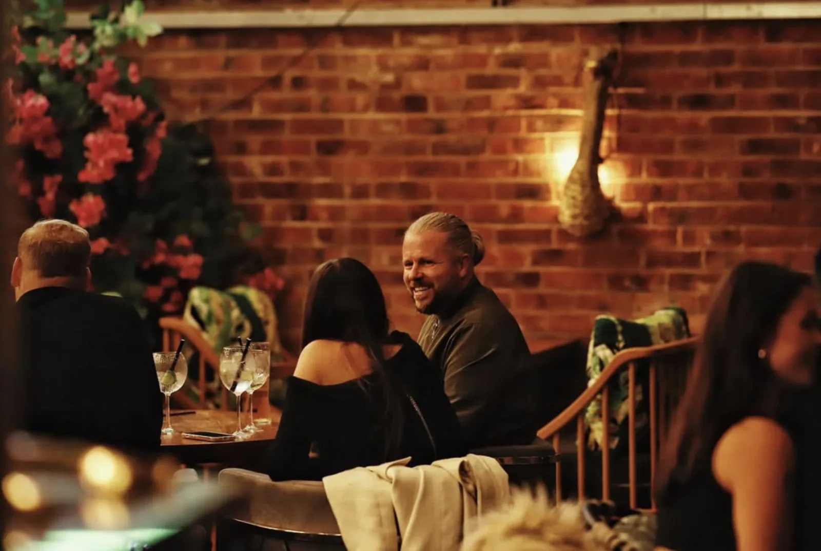 Guests enjoying drinks together at a table